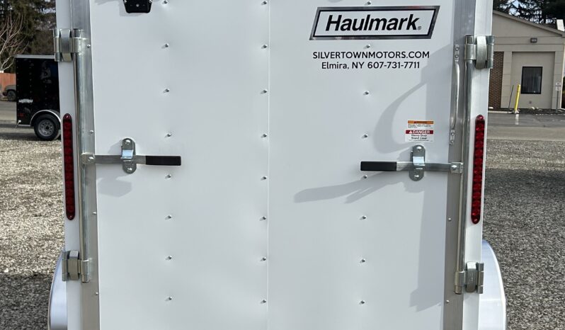 2024 HAULMARK PASSPORT DELUXE 5′ x 8′ ENCLOSED CARGO TRAILER-2,990 GVW V-NOSE, REAR RAMP DOOR(PP58S2-D) full