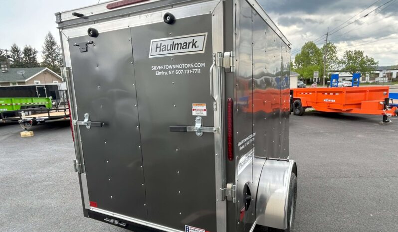 2024 HAULMARK PASSPORT DELUXE 5′ x 8′ ENCLOSED CARGO TRAILER-2,990 GVW V-NOSE, REAR RAMP DOOR(PP58S2-D) full