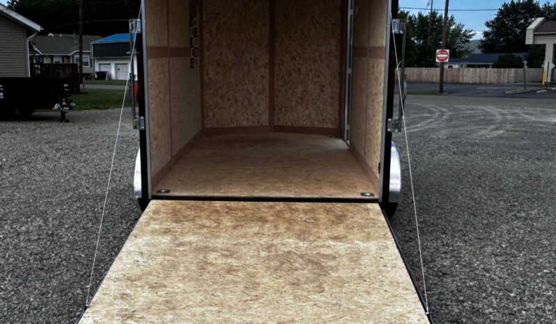 2026 HAULMARK PASSPORT DELUXE 7′ x 12′ ENCLOSED CARGO TRAILER-7,000 GVW, 7’0″ INTERIOR, V-NOSE, ELECTRIC BRAKES AND RAMP DOOR (PP712T2-D)-SILVER full