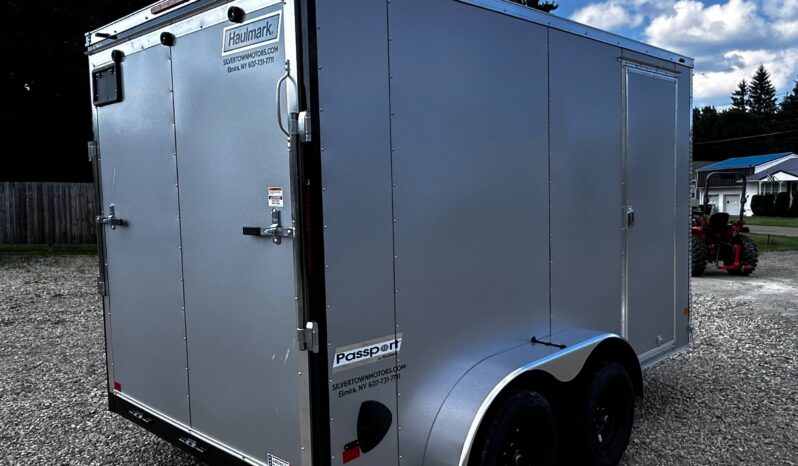 2026 HAULMARK PASSPORT DELUXE 7′ x 12′ ENCLOSED CARGO TRAILER-7,000 GVW, 7’0″ INTERIOR, V-NOSE, ELECTRIC BRAKES AND RAMP DOOR (PP712T2-D)-SILVER full