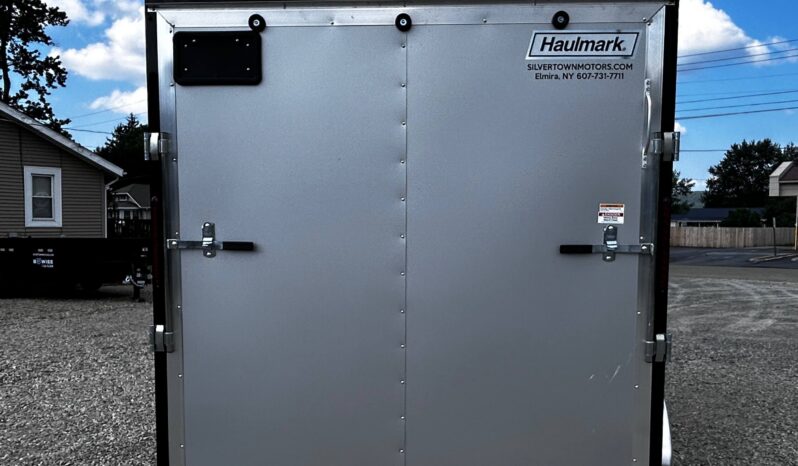 2026 HAULMARK PASSPORT DELUXE 7′ x 12′ ENCLOSED CARGO TRAILER-7,000 GVW, 7’0″ INTERIOR, V-NOSE, ELECTRIC BRAKES AND RAMP DOOR (PP712T2-D)-SILVER full