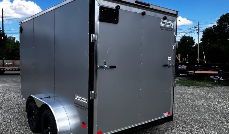 2026 HAULMARK PASSPORT DELUXE 7′ x 12′ ENCLOSED CARGO TRAILER-7,000 GVW, 7’0″ INTERIOR, V-NOSE, ELECTRIC BRAKES AND RAMP DOOR (PP712T2-D)-SILVER full